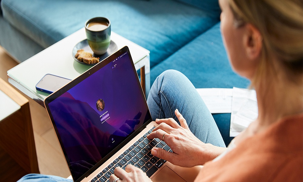 A woman using a laptop.