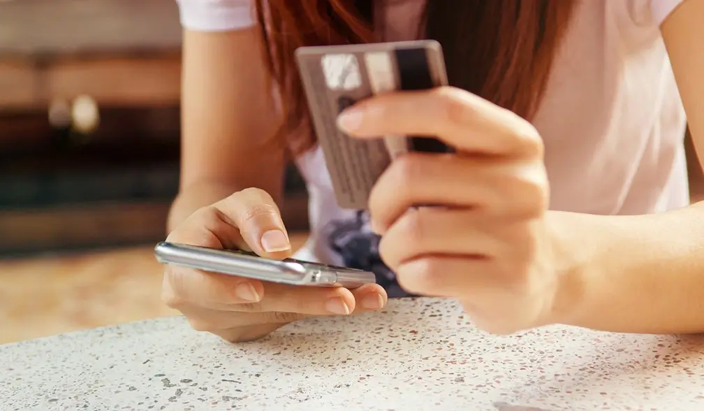 Woman online shopping on her phone