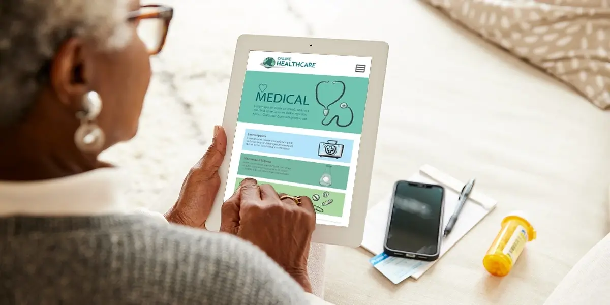 A woman using a tablet to check medical records.