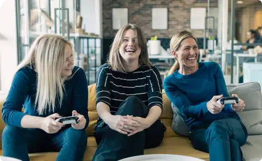 Woman laughing while playing video games