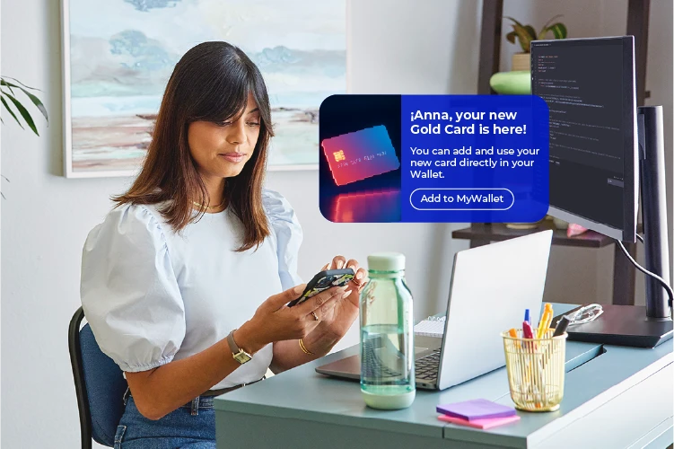 Woman receiving a text update on new credit card