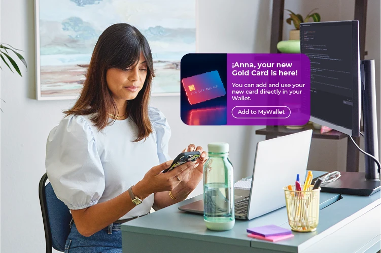 Woman receiving a text update on new credit card